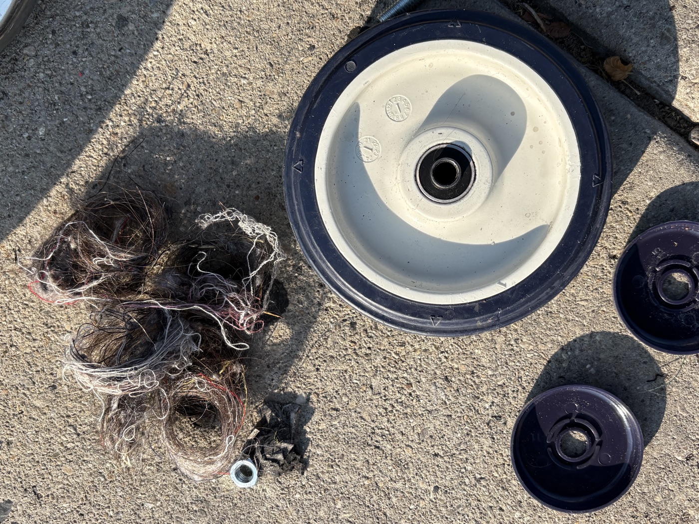 Debris removed from a cart wheel axle