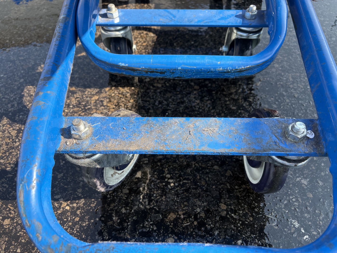 Close-up of shopping cart wheel cleaning