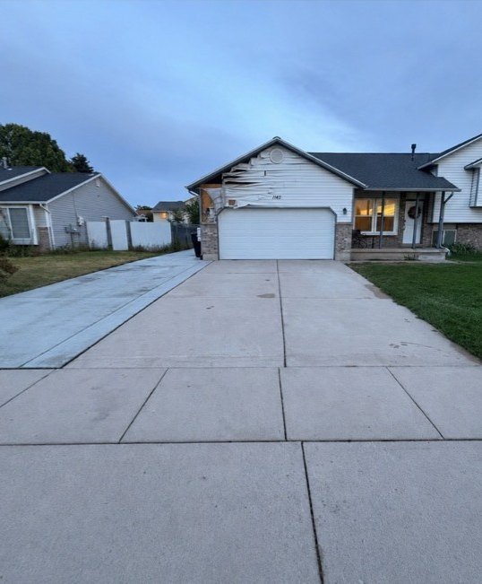 Clean Salt Lake City driveway after Dirt Gone Wash Co pressure washing